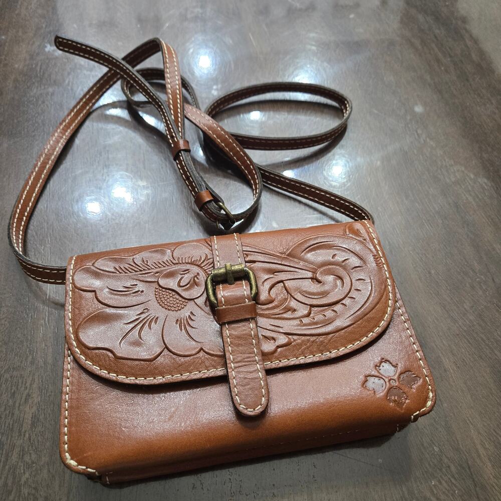 This is a Patricia Nash Torri Tooled Leather Crossbody bag.